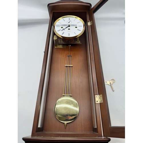 59 - Fine Kieninger Pendulum wall Clock with white enamel face in mahogany and glazed cased - second repe... 