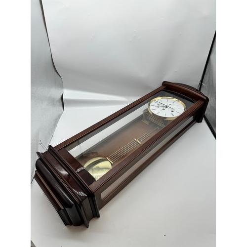 59 - Fine Kieninger Pendulum wall Clock with white enamel face in mahogany and glazed cased - second repe... 