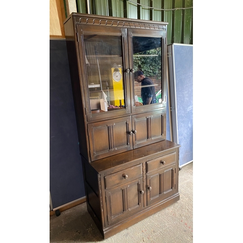 458 - Dark Ercol Blue label glazed cabinet over cupboard

Please see images for all dimensions.