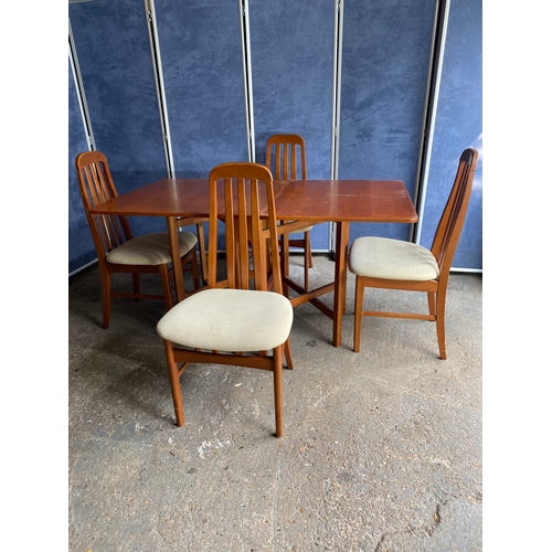 463 - Mid century Teak Gate leg table and four chairs.

Please see images for all dimensions.