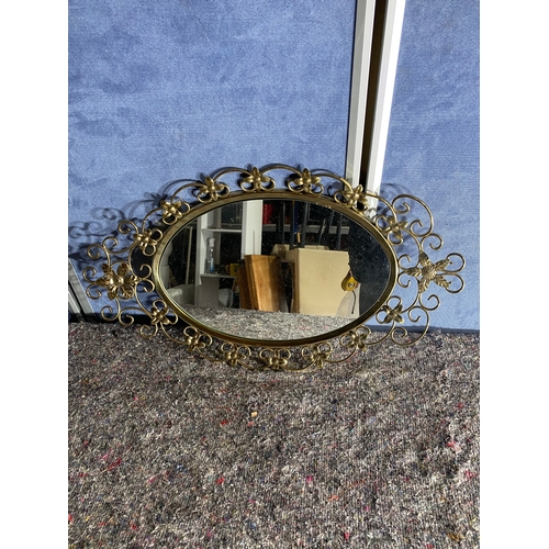 545 - Lovely floral metal framed mirror.