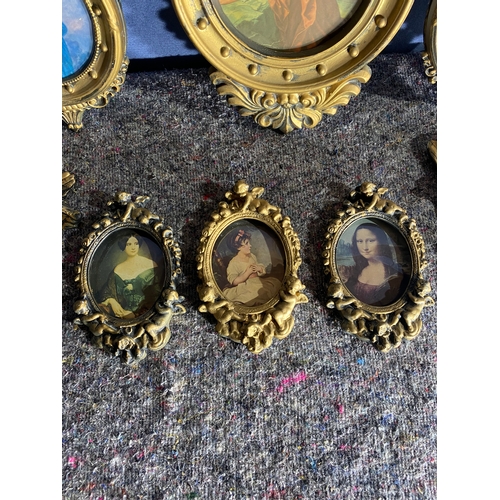 549 - A collection of Gilt framed items and two cherubs.