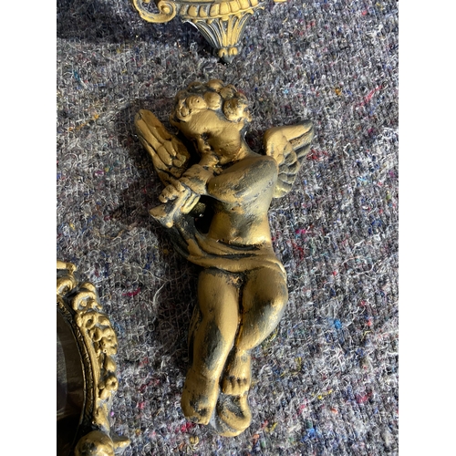 549 - A collection of Gilt framed items and two cherubs.