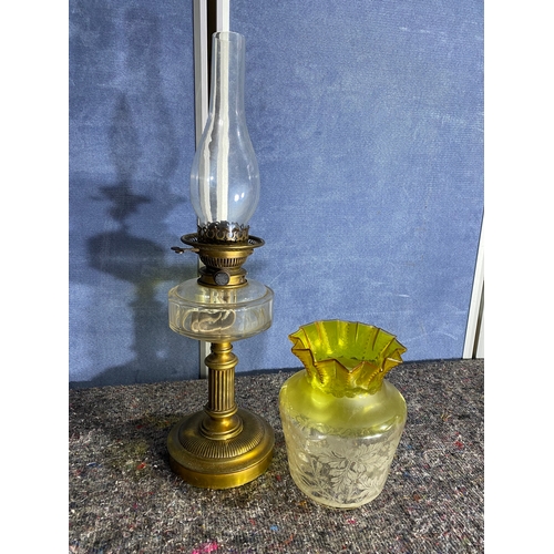 565 - A pair of brass and coloured glass etched shades paraffin lamps. One has been converted