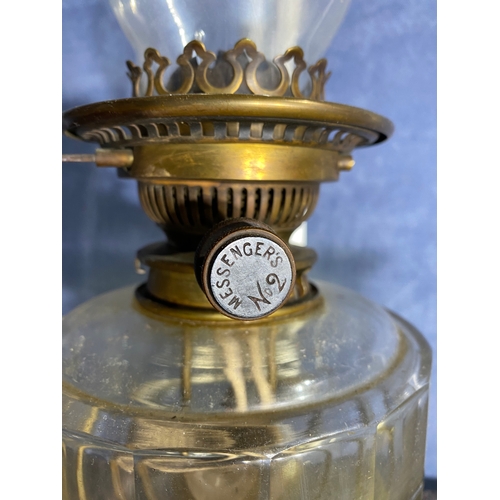 565 - A pair of brass and coloured glass etched shades paraffin lamps. One has been converted