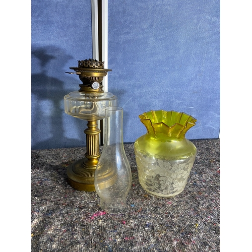 565 - A pair of brass and coloured glass etched shades paraffin lamps. One has been converted