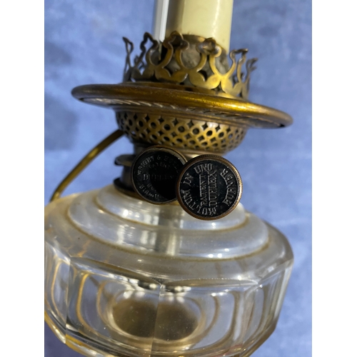 565 - A pair of brass and coloured glass etched shades paraffin lamps. One has been converted