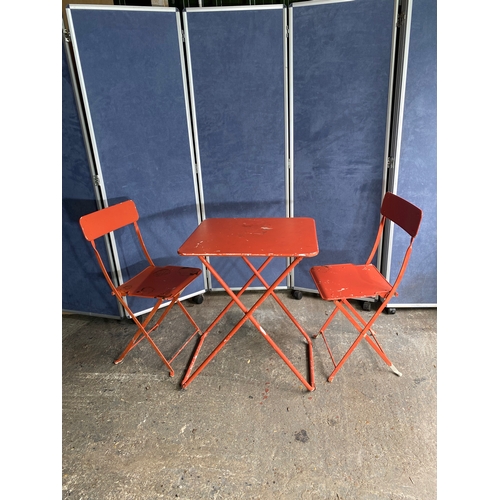 582 - Vintage Orange foldable garden / bistro table and two chairs.