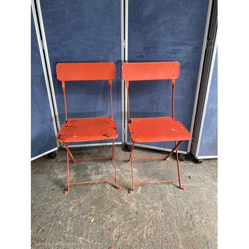 582 - Vintage Orange foldable garden / bistro table and two chairs.