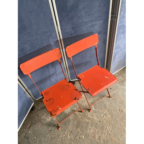 582 - Vintage Orange foldable garden / bistro table and two chairs.