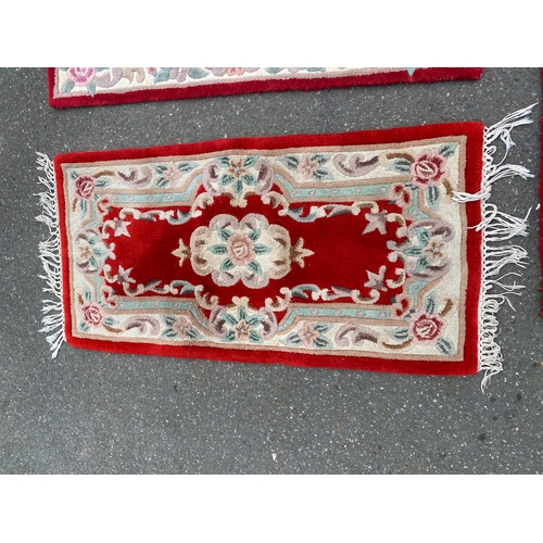 591 - A lot of four Indian Aubusson style Red rugs / carpets