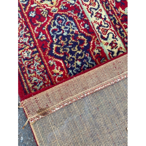 602 - Large Wilton Wool red Rug/Carpet

Dimensions - 9' x 2'6