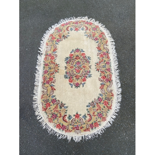 606 - Hand made in Hong Kong oval Rug. 

Dimensions - 2'6