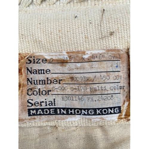 606 - Hand made in Hong Kong oval Rug. 

Dimensions - 2'6