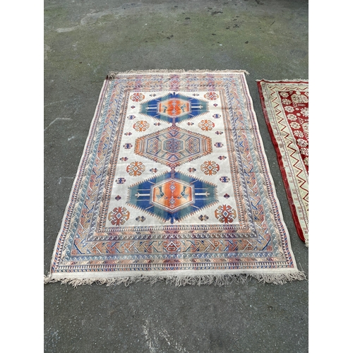 609 - Two Persian carpets / rugs