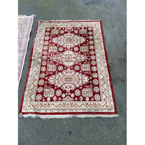 609 - Two Persian carpets / rugs