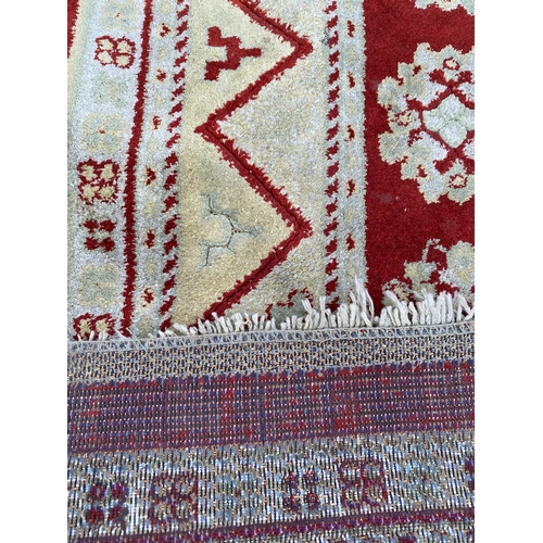 609 - Two Persian carpets / rugs