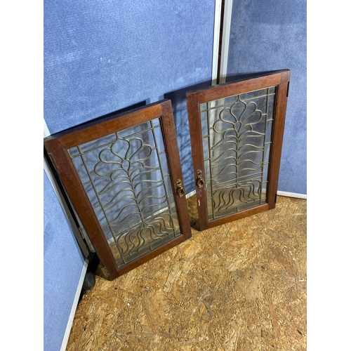 331 - A pair of  glass leaded glass cabinet doors.