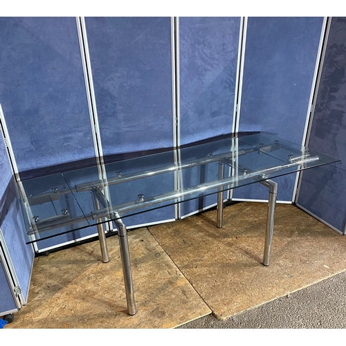 339 - Extendable glass dining table on chrome frame. 

Please see images for dimensions.