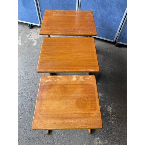 362 - A nest of three mid century teak tables. 

Dimensions of largest - 22