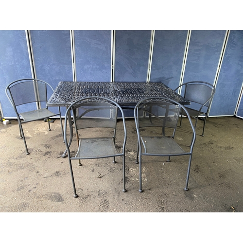 365 - Large metal garden table and four tub style chairs. 

Please see images for all dimensions.