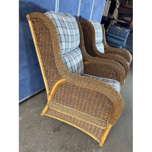 396 - Two good quality wicker conservatory arm chairs.