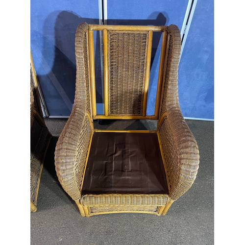 396 - Two good quality wicker conservatory arm chairs.