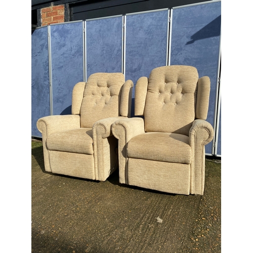 401 - A pair of upholstered HSL electric rising armchairs. 

Dimensions - 30