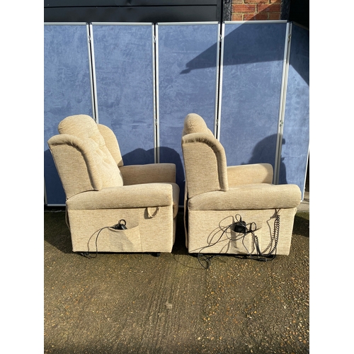 401 - A pair of upholstered HSL electric rising armchairs. 

Dimensions - 30