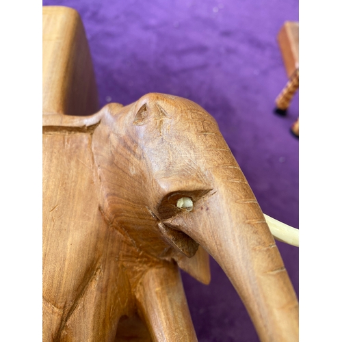 450 - Quantity of wooden Giraffe ornaments, Elephant book ends.