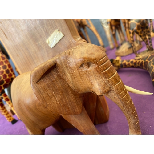 450 - Quantity of wooden Giraffe ornaments, Elephant book ends.