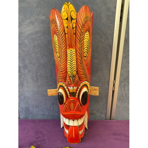 451 - Two wooden Gurulu masks