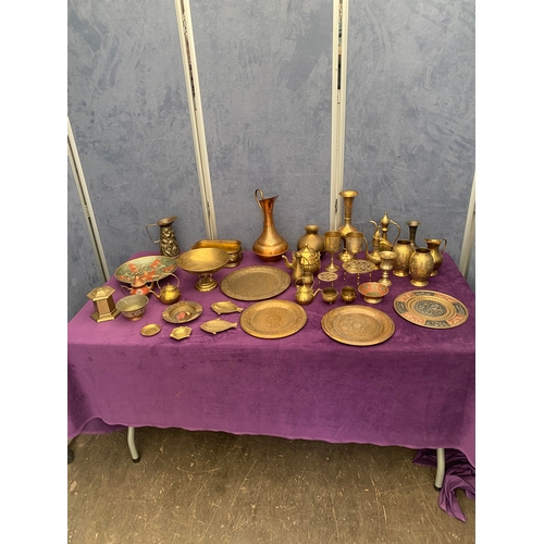 456 - Large quantity of brass collectables including teapots, pourers, plates and jugs.