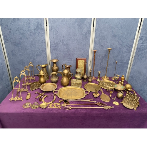 467 - A Large collection of vintage brass collectables including trays, Jugs, picture / letter holders.