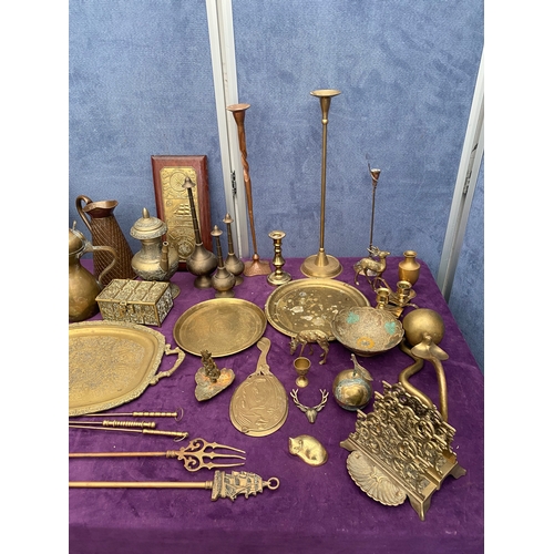 467 - A Large collection of vintage brass collectables including trays, Jugs, picture / letter holders.