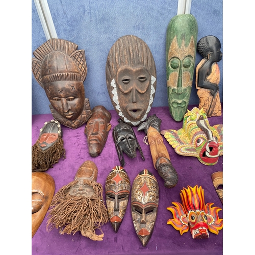 474 - A large collection of African / tribal masks.