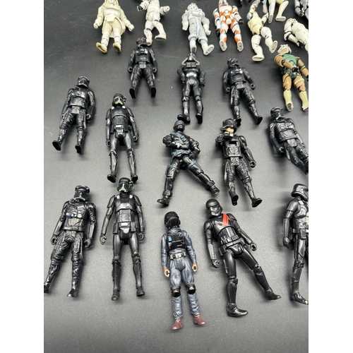 495 - A quantity of Star Wars Storm Trooper / Clone / Tie Fighter Action Figures from last 20 years