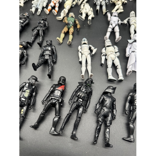 495 - A quantity of Star Wars Storm Trooper / Clone / Tie Fighter Action Figures from last 20 years