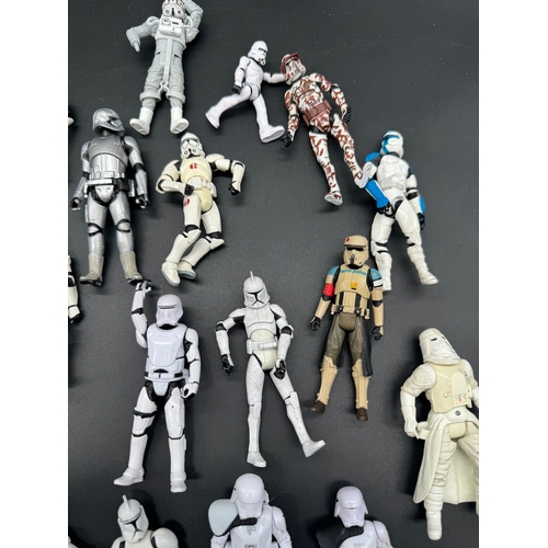 495 - A quantity of Star Wars Storm Trooper / Clone / Tie Fighter Action Figures from last 20 years