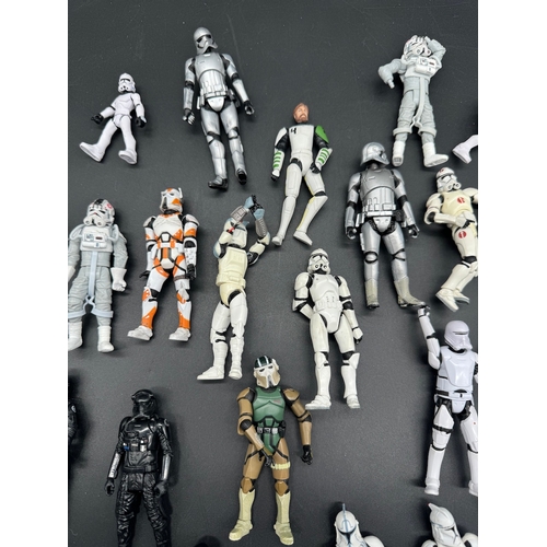 495 - A quantity of Star Wars Storm Trooper / Clone / Tie Fighter Action Figures from last 20 years