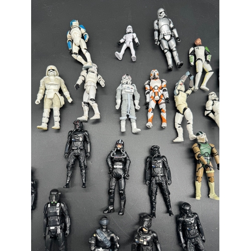 495 - A quantity of Star Wars Storm Trooper / Clone / Tie Fighter Action Figures from last 20 years