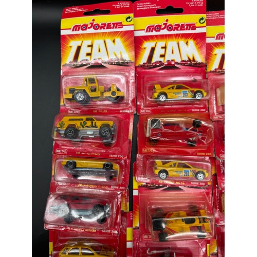 164 - A collection of 23 Majorette Team Serie 200 Diecast Model Cars / Vehicles all carded