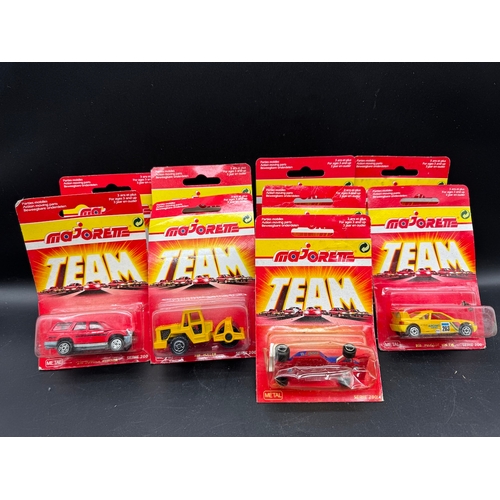 164 - A collection of 23 Majorette Team Serie 200 Diecast Model Cars / Vehicles all carded