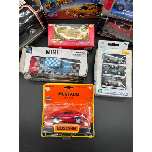 169 - A collection of boxed toy / models cars