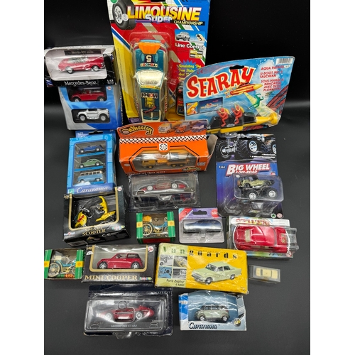 175 - A collection of various diecast model cars / vehicles / toys all boxed / cased