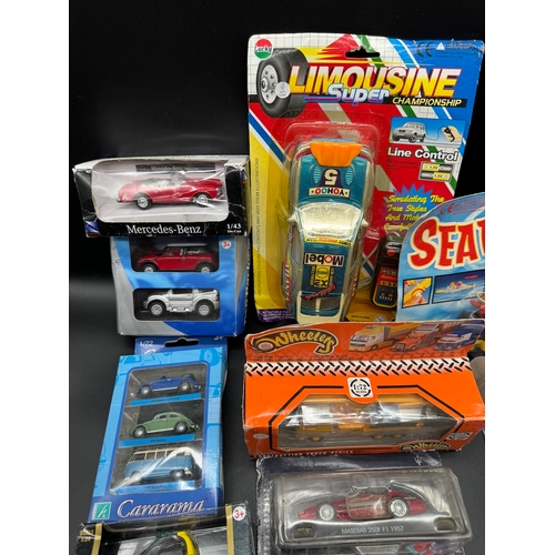 175 - A collection of various diecast model cars / vehicles / toys all boxed / cased