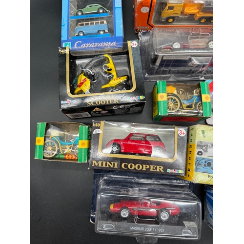 175 - A collection of various diecast model cars / vehicles / toys all boxed / cased