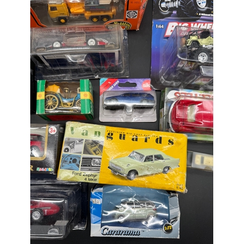 175 - A collection of various diecast model cars / vehicles / toys all boxed / cased