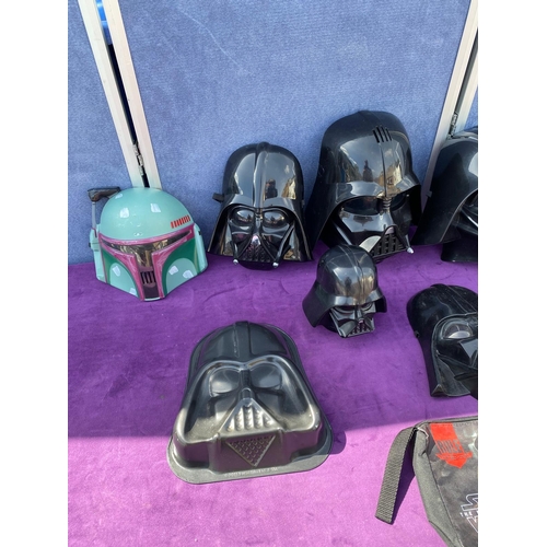 520 - A collection of Star Wars Darth Vader / Boba Fett Face masks + bags