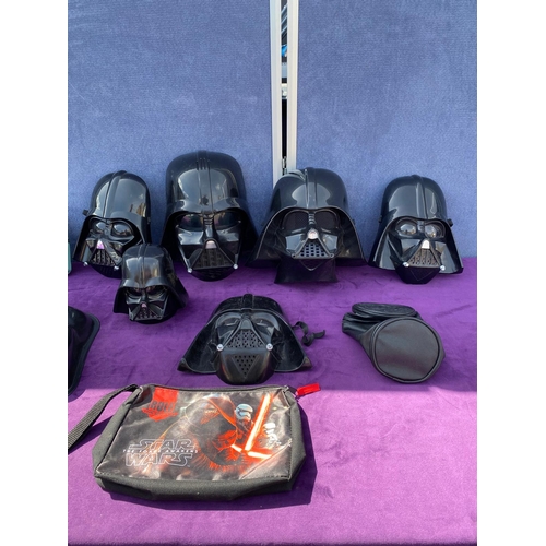 520 - A collection of Star Wars Darth Vader / Boba Fett Face masks + bags